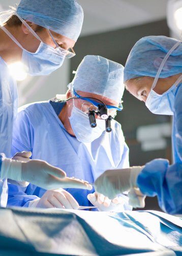 Surgeons conducting surgery
